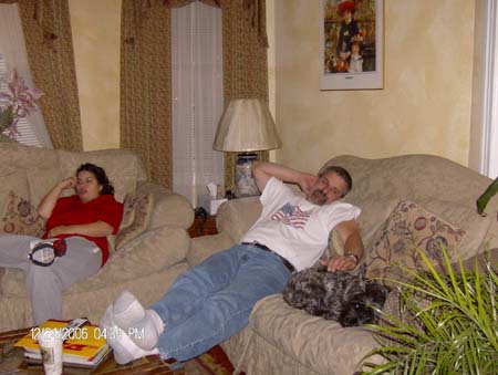 Danielle and Gus laying back on the couch