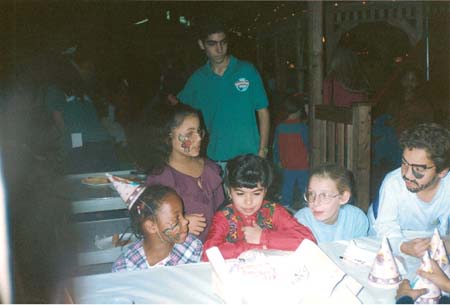 Danielle's Birthday Party in front of her cake